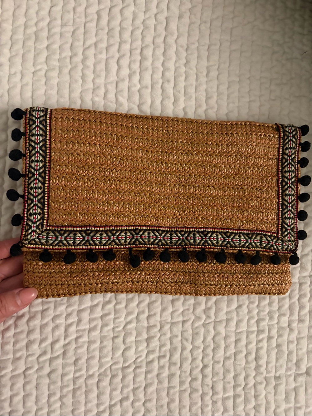 Woven Straw Fold-Over Clutch with Black Pom Trim